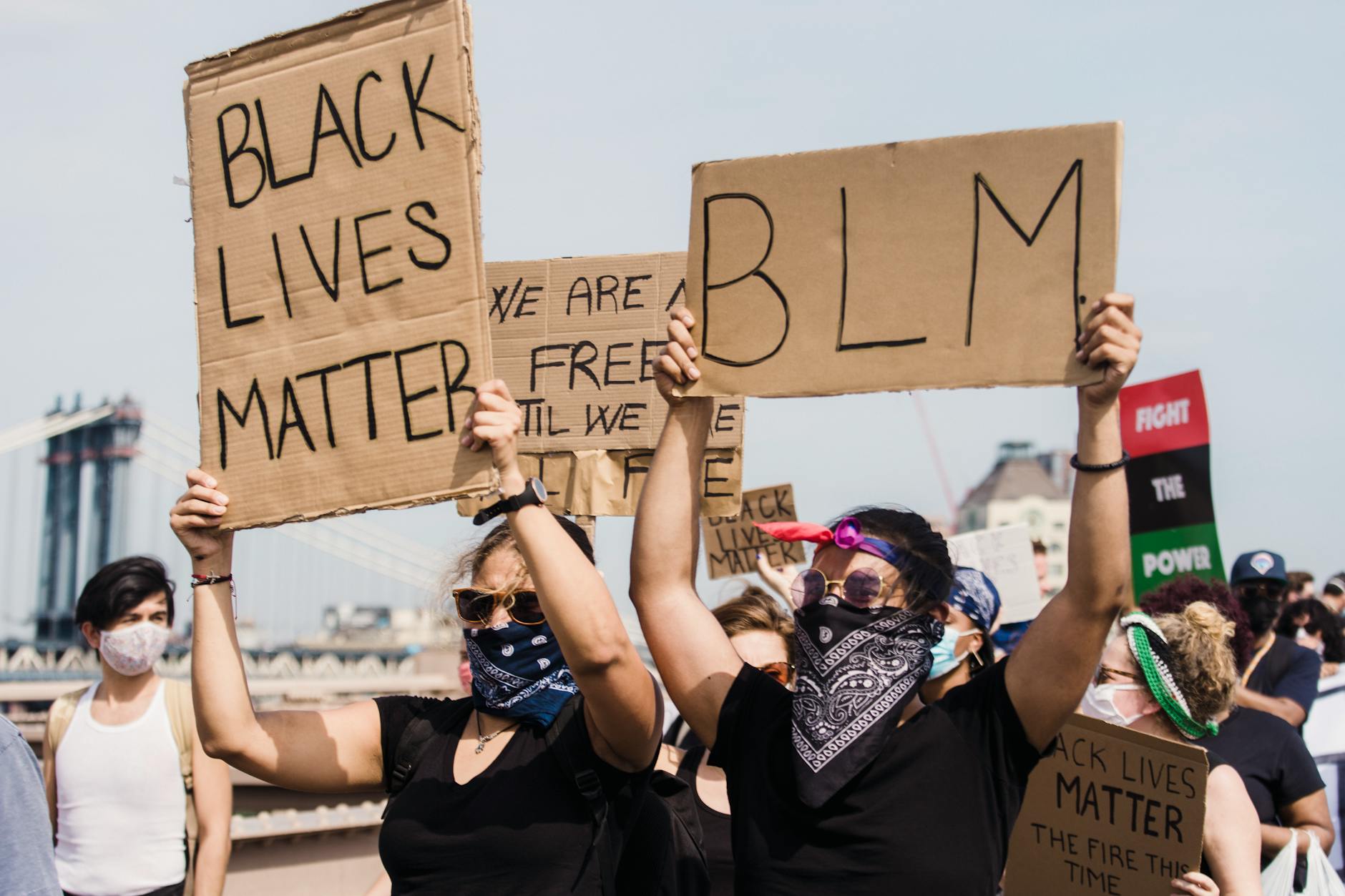 people protesting and holding signs