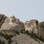 sculptures of faces on a mountain