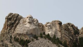 sculptures of faces on a mountain