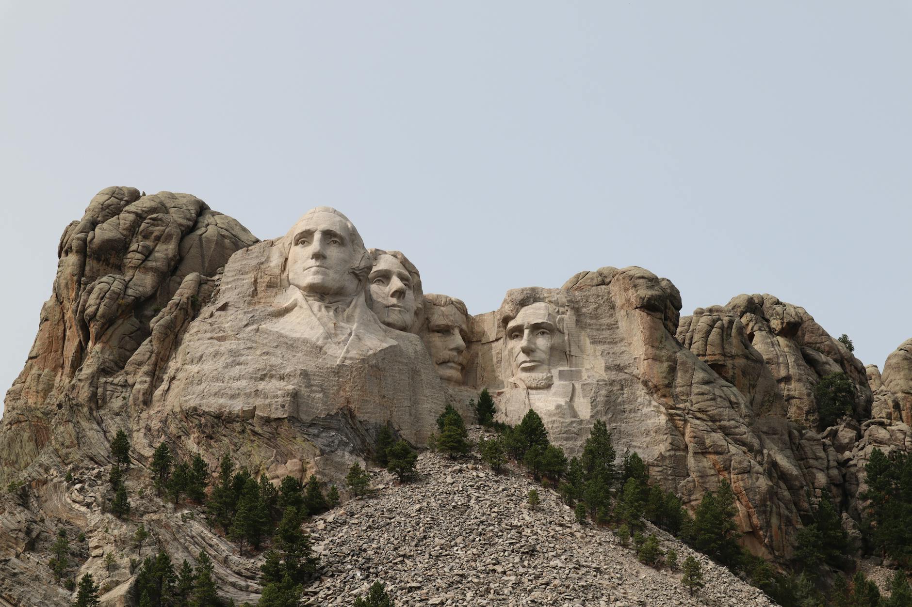 sculptures of faces on a mountain